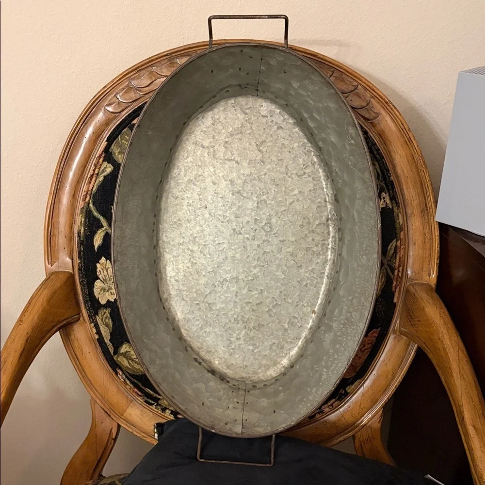Galvanized Distressed Metal Oval tray with handles and hammered finish.